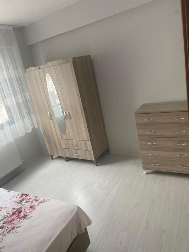 a bedroom with a dresser and a bed and a dresser at 1+1 in Hopa