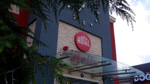 a krispy kreme sign on the side of a building at Hotel Labella Bergama in Bergama