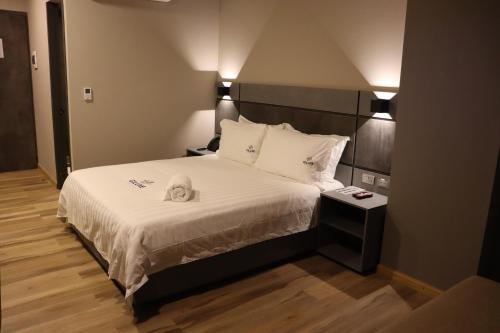 Un ou plusieurs lits dans un hébergement de l'établissement Giluxe Hotel