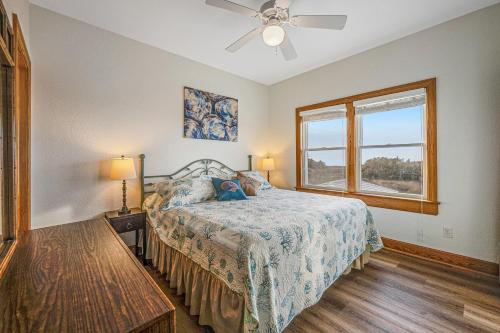 a bedroom with a bed and a window at Blue Waters #18-22 in Avon