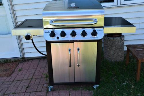 a barbecue grill with a stove top on a patio at Remodeled, Grill, Outside Seating, Dock, Swimming in Brainerd