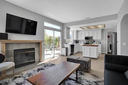 a living room with a fireplace and a kitchen at Napa, Sonoma, SF, & Ferry in Mins w/ King Bed in Vallejo