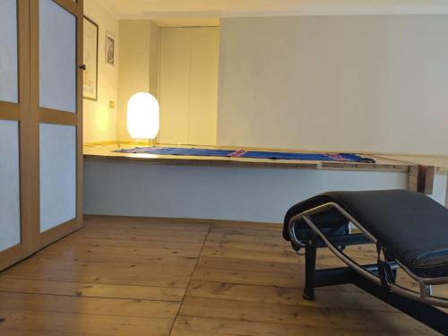 a room with a bed and a table in a room at Atelier Relax Petit Turin - Centralissimo in Turin