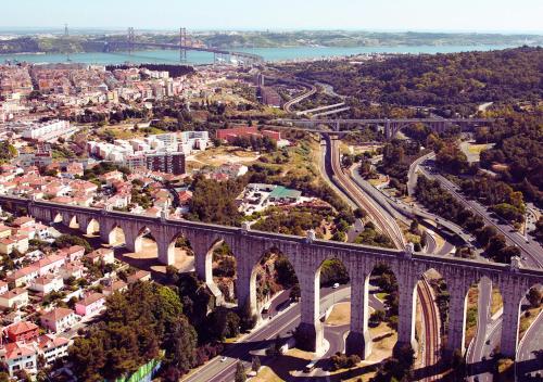 an aerial view of a bridge over a city at Casas da Eva - Campolide in Lisbon
