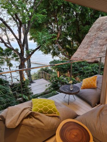 a living room with a couch and a table at The Headland Villa 2, Samui in Koh Samui