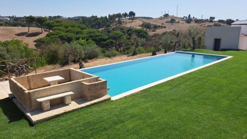 an overhead view of a swimming pool in a yard at Quinta de Matrena in Macieiros