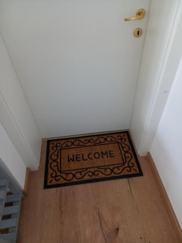 a welcome mat on the floor of a hallway at Lovely Rita in Kaprun