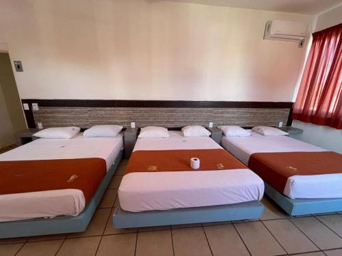 Katil atau katil-katil dalam bilik di Hotel Albatros