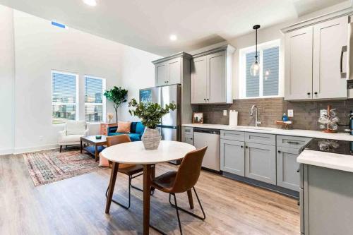 a kitchen with a table and a living room at Pelican house*King bed*Fast WiFi*Book now in Lafayette