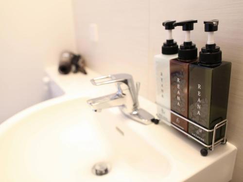 a bathroom sink with a soap dispenser on it at HOTEL KUTEKUN - Vacation STAY 31431v in Naka-shibetsu