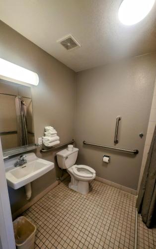 a bathroom with a toilet and a sink at Econo Lodge in Idaho Falls