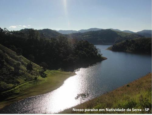 an aerial view of a river with trees and water at Casa Apu Honey Moon Suite Pague duas noites minimo e a terceira e brinde menos feriados in Natividade da Serra