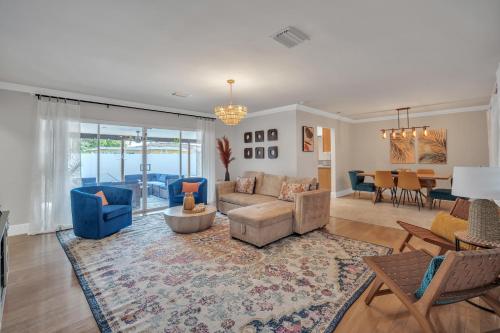 a living room with a couch and a table at Lauderdale By The Sea home in Fort Lauderdale