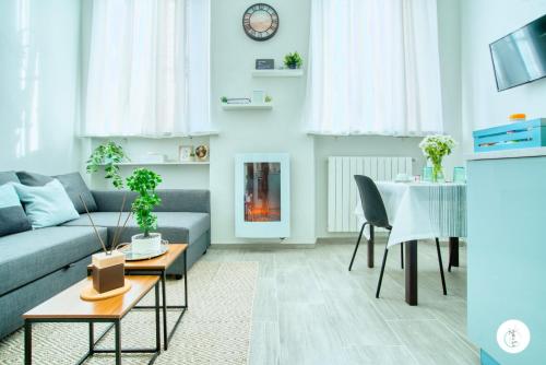 a living room with a couch and a table at In Curti 1913 in Parabiago
