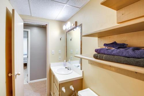 a bathroom with a sink and a mirror at Shawnee Vacation Rental about 11 Mi to Kansas City! in Shawnee