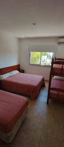 A bed or beds in a room at HOTEL 17 DE NOVIEMBRE