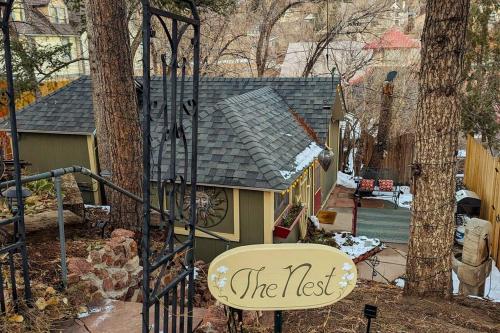 a sign that reads the last in front of a house at The Nest Cottage with Hot Tub in Downtown Manitou Springs in Manitou Springs