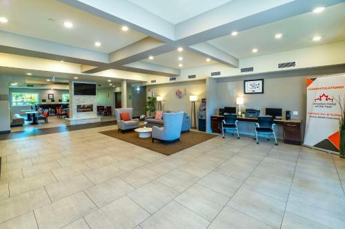 a lobby of a hospital with chairs and a table at Comfort Inn & Suites in Terrace