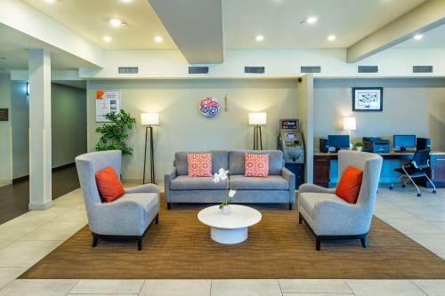 a lobby with two chairs and a couch and a table at Comfort Inn & Suites in Terrace