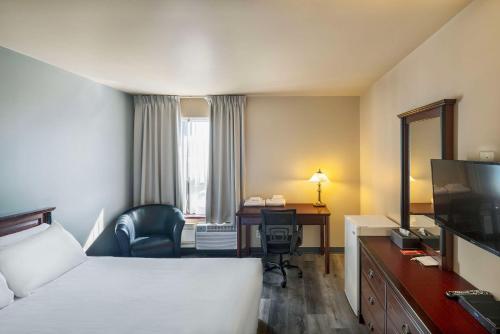 Ένα ή περισσότερα κρεβάτια σε δωμάτιο στο Econo Lodge