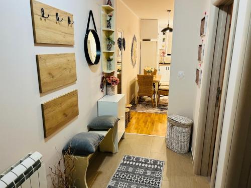 a hallway with white walls and wooden doors at Aero Fly apartment Belgrade in Belgrade