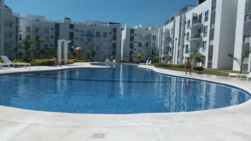 a large swimming pool in the middle of a building at Departamento en Acapulco Diamante in Acapulco