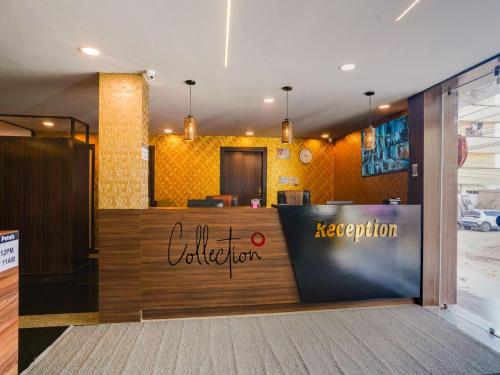 a restaurant with a reception desk in a building at Super Collection O Hotel Blue Petals in Shamshabad