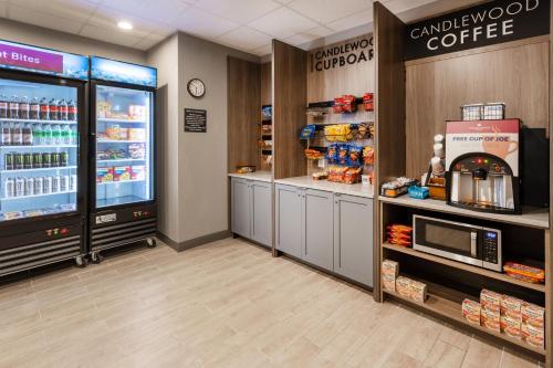 a coffee shop with a refrigerator and a microwave at Candlewood Suites - Atlanta - Kennesaw by IHG in Kennesaw