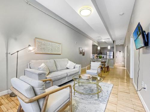 a living room with a couch and a table at Beautiful 2BR2BA in Bldg connected to Skywalk in Des Moines
