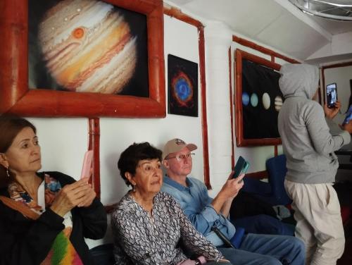 a group of people sitting in a train at hostal Sueño Paraiso- Observatorio astronómico in Popayan