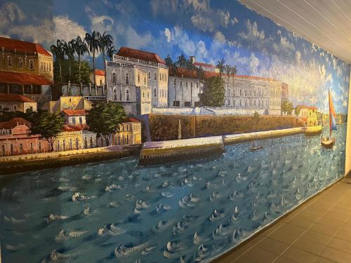 a mural of a painting of a river at Solar dos Poetas in São Luís