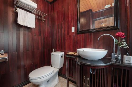 a bathroom with a toilet and a sink at Ruby Cruise in Ha Long