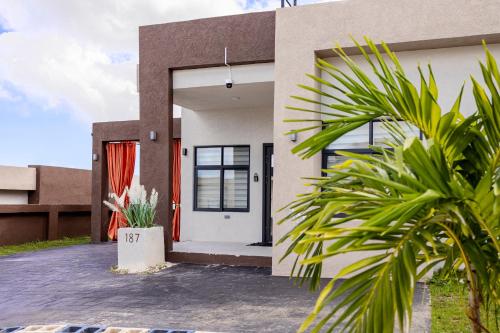 a rendering of a house with a front door at Emerald SunDara Villa Ochi in Ocho Rios