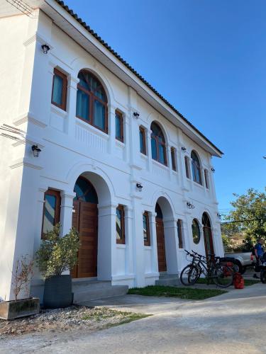 a white building with brown doors on it at B2 Hotel Savannakhet in Savannakhet