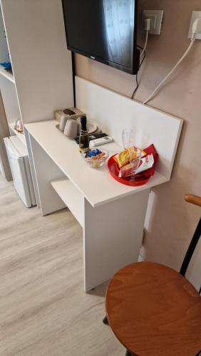 a kitchen with a counter with a plate of food on it at La Casa di Mimmo in Gradara