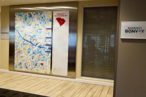 a lobby with a wall with a map on it at TownePlace Suites By Marriott Columbia West/Lexington in West Columbia