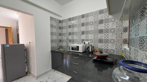 Η κουζίνα ή μικρή κουζίνα στο Tranquil Serviced Apartments - HSR Layout