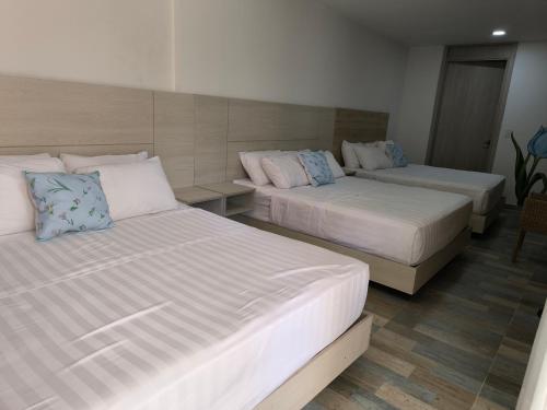 Cama o camas de una habitación en La Colina Balance Hotel
