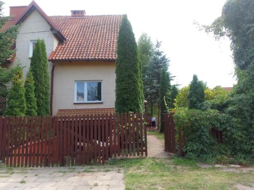 a fence in front of a house at Wegorzewianka 11 in Węgorzewo