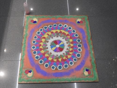 a rangoli is hanging on the ceiling at Lago Leisure Resort & Spa in Cherai Beach