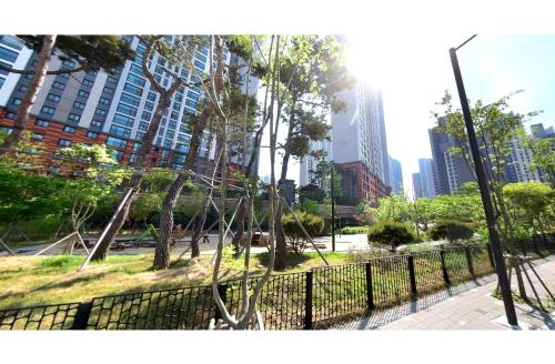 a swing set in a park in a city at Apartment near Ilsan Dongkuk University Hospital in Goyang