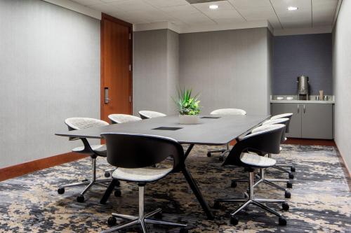 an office meeting room with a table and chairs at JW Marriott Grand Rapids in Grand Rapids