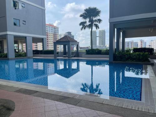 a swimming pool in a building with a gazebo at Dalamanda 3Pax Sunway Velocity Balcony CItyView in Kuala Lumpur