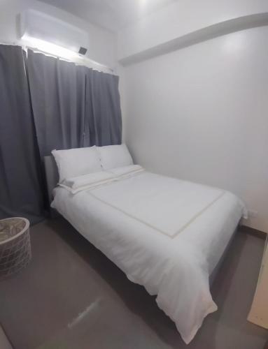 Cama o camas de una habitación en Bloom Residences Condo 2Br