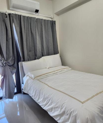 Cama o camas de una habitación en Bloom Residences Condo 2Br