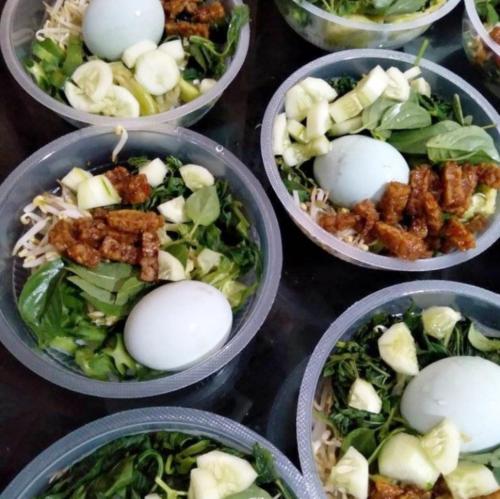 a group of bowls of food with eggs in them at Skye Nest in Yogyakarta