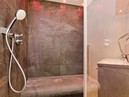 a shower with a glass door in a bathroom at Two-Bedroom Holiday home in Wendtorf 29 in Wendtorf