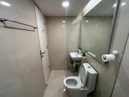 a bathroom with a toilet and a sink at Egyptian studio apartment at hiranandani thane in Thane