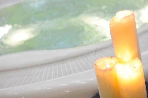 two candles are sitting on a window sill at Hotel Montana in Madonna di Campiglio