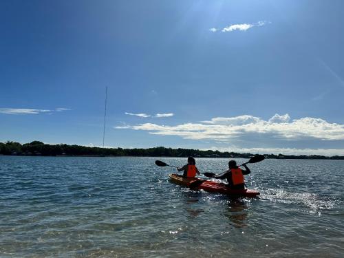 two people are in a kayak in the water at Larue Pocket Villa in Calatagan
